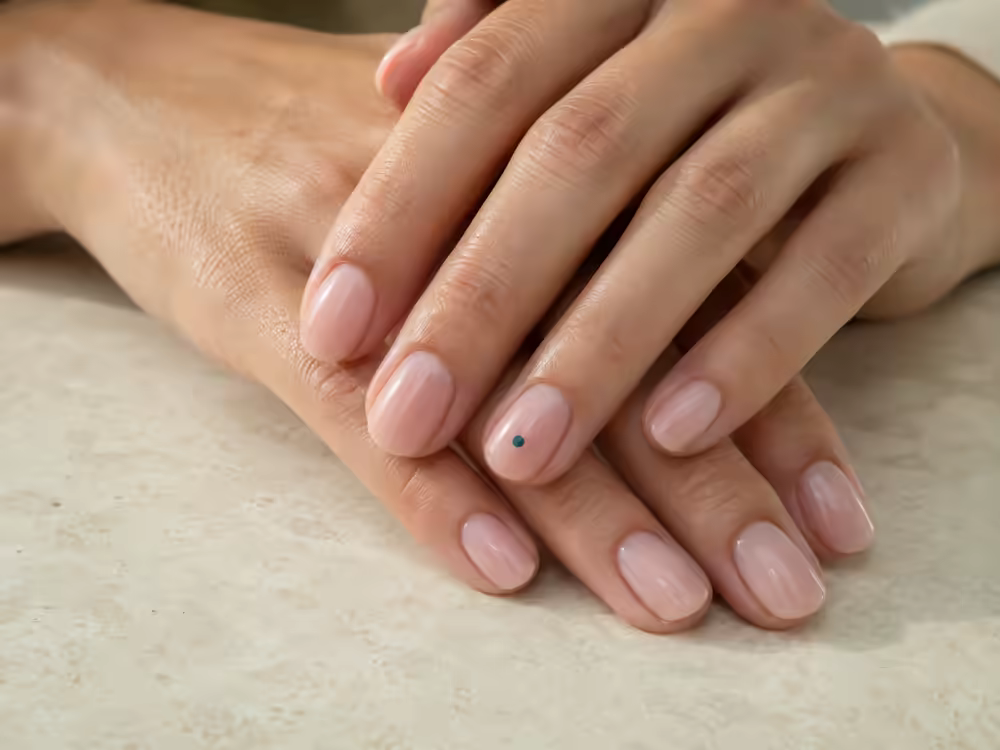 Editorial image of a natural milky nude Builder Gel manicure