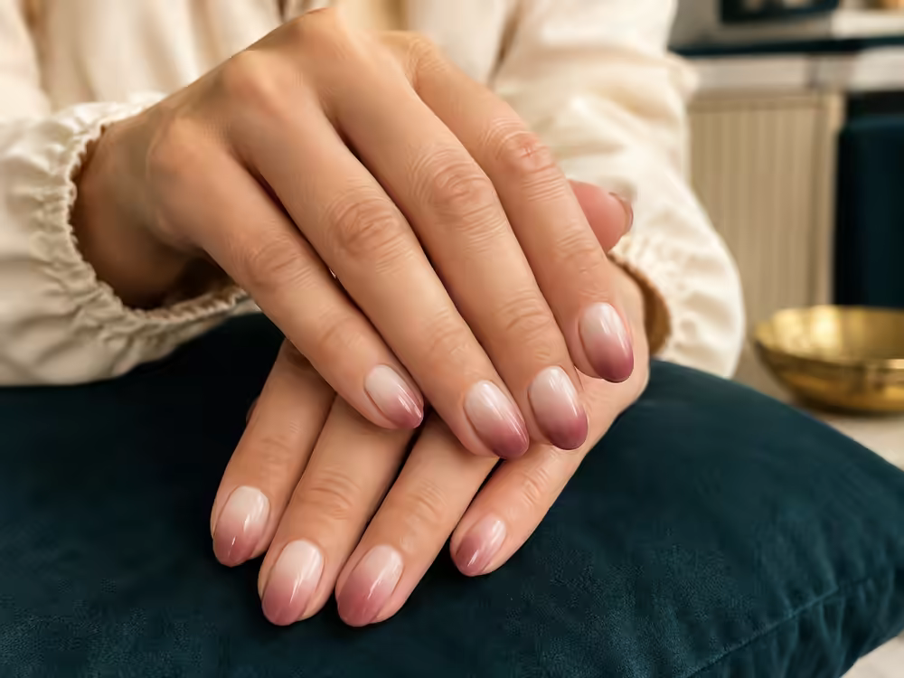 Editorial image of taupe and cocoa dip powder nails